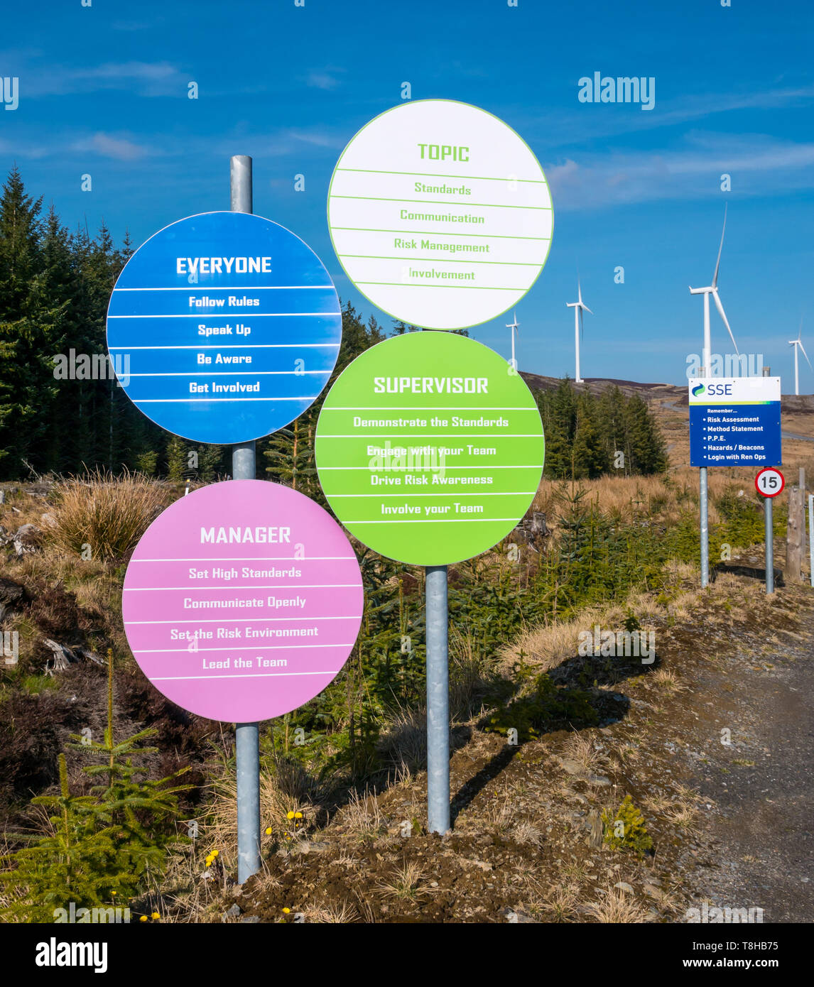 Scottish and Southern Energy (SSE) safety notices and wind turbines on hill at Griffin wind farm, Perthshire, Scotland, UK Stock Photo