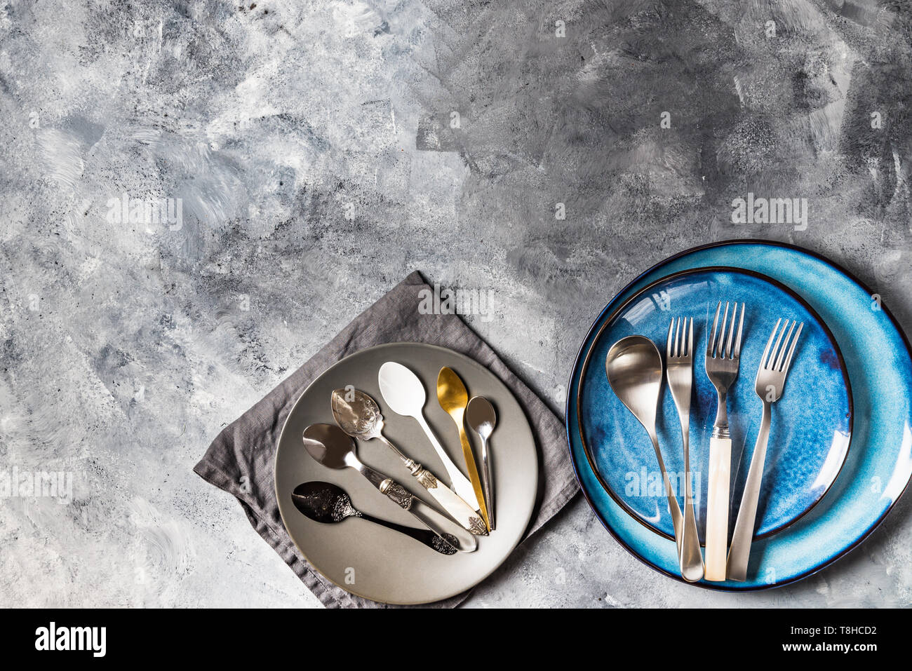 Empty Blue Plates on Grey Background Stock Photo