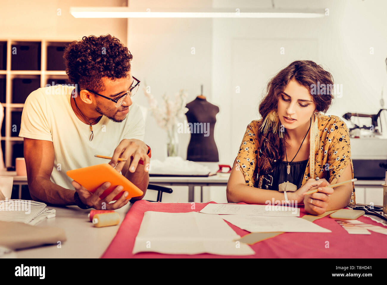 Young designers working together in a workshop. Stock Photo