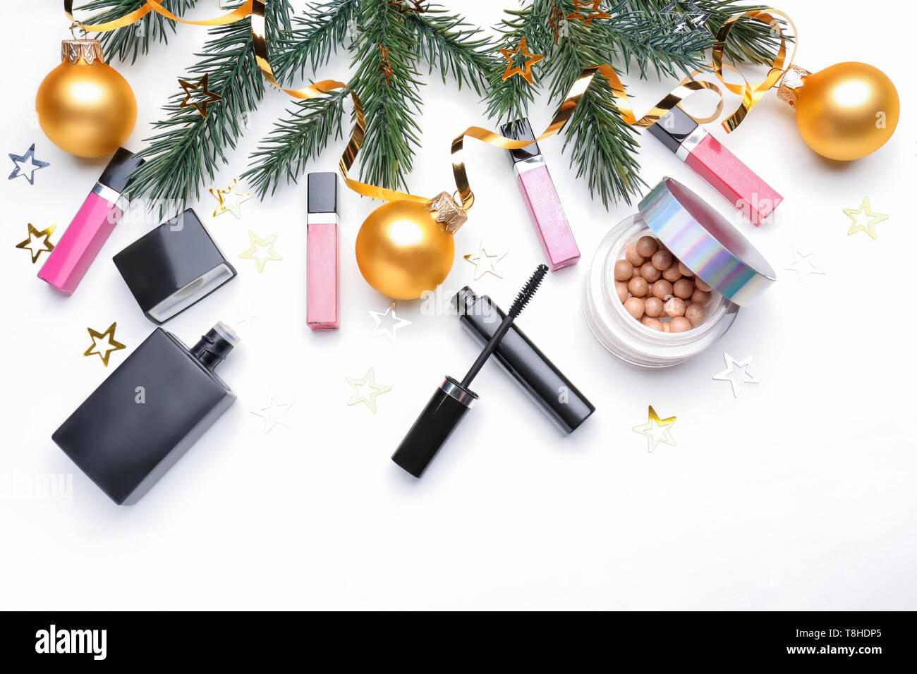 Set of cosmetics with Christmas decorations on white background Stock