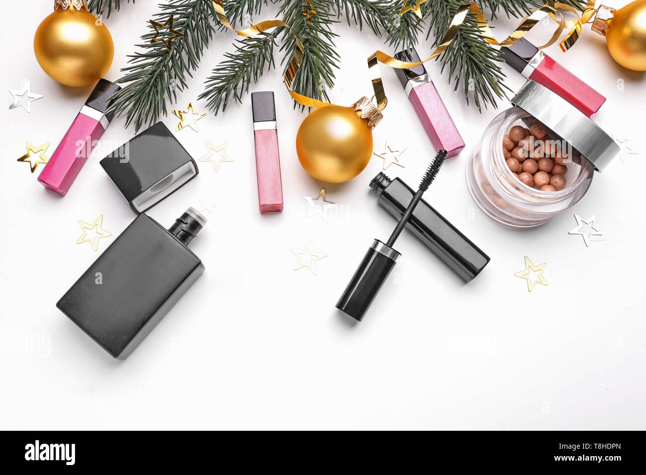 Set of cosmetics with Christmas decorations on white background Stock