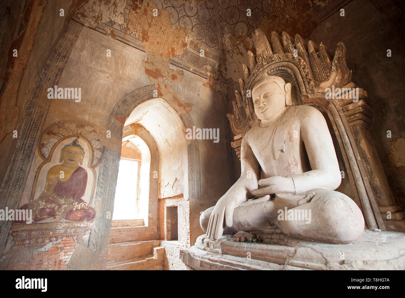 Buddha statue and paintings in a temple near Alotawpyae temple, Old Bagan and Nyaung U village area, Mandalay region, Myanmar, Asia Stock Photo