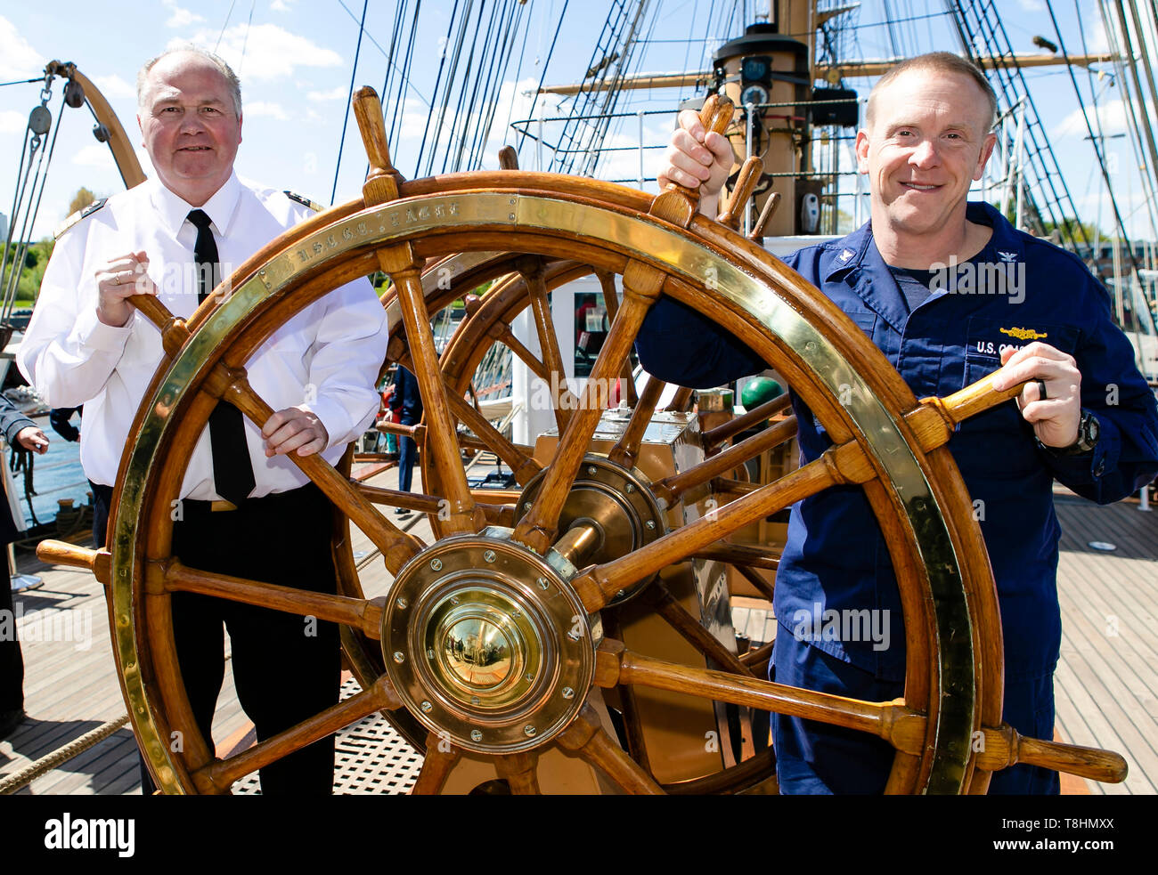 Kiel, Germany. 13th May, 2019. The captain of the American sailing training ship Eagle, Matthew Meilstrup (r), and the commander of the Gorch Fock, Nils Brandt, are on deck. The US Coast Guard Bark is the sister of the German sailing training ship Gorch Fock and will visit the state capital until Tuesday. Credit: Frank Molter/dpa/Alamy Live News Stock Photo
