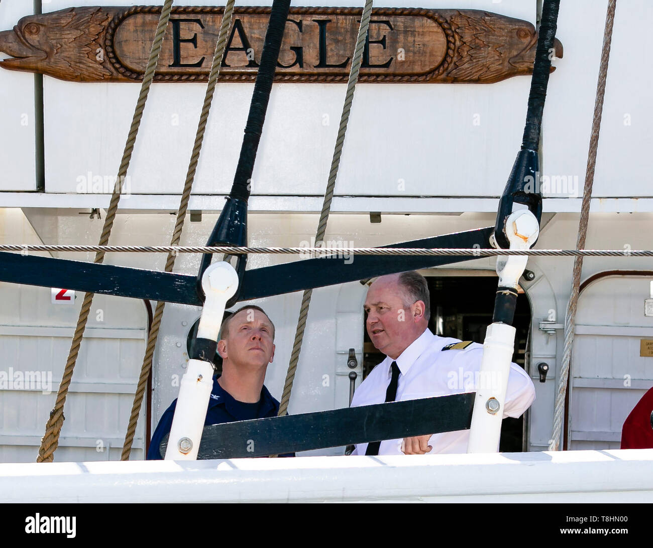 Kiel, Germany. 13th May, 2019. The captain of the American sailing training ship Eagle, Matthew Meilstrup (l), and the commander of the Gorch Fock, Nils Brandt, are talking. The US Coast Guard Bark is the sister of the German sailing training ship Gorch Fock and will visit the state capital until Tuesday. Credit: Frank Molter/dpa/Alamy Live News Stock Photo