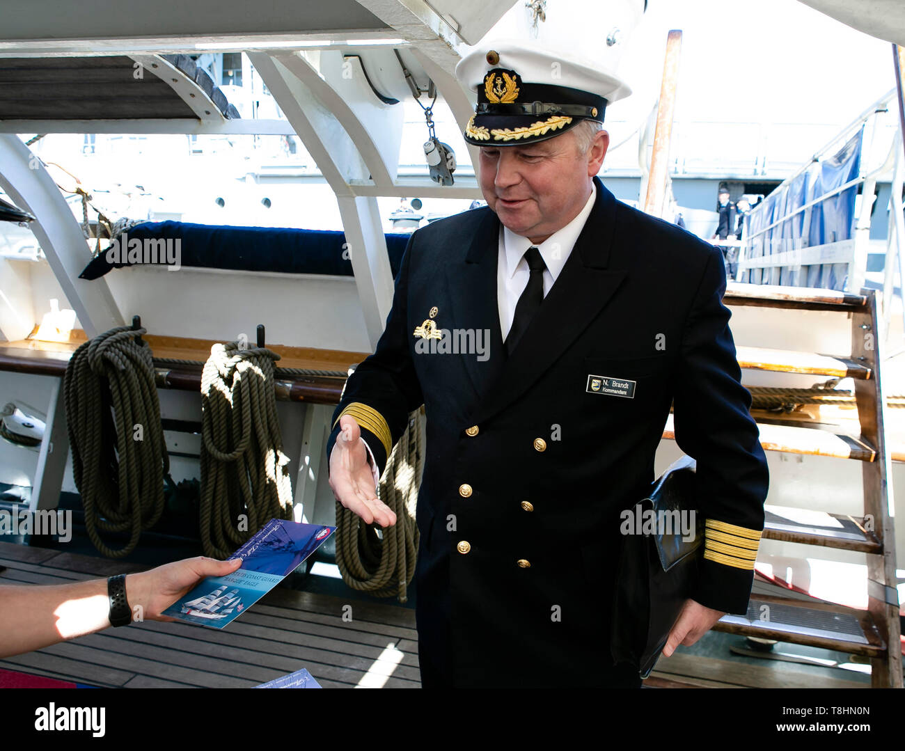 Kiel, Germany. 13th May, 2019. The commander of the Gorch Fock, Nils Brandt, enters the American sailing training ship Eagle. The US Coast Guard Bark is the sister of the German sailing training ship Gorch Fock and will visit the state capital until Tuesday. Credit: Frank Molter/dpa/Alamy Live News Stock Photo
