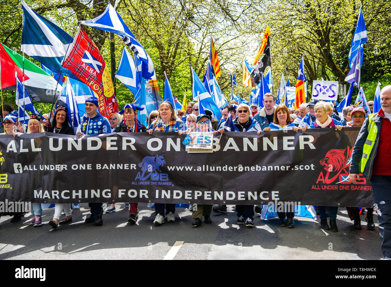 Glasgow, Glasgow City, UK. 4th May, 2019. Members of the crowd march holding the AUOB banner down Kelvin Way, Glasgow during the protest.Thousands of Scottish independence supporters marched through Glasgow as part of the ''˜all under one banner' (AUOB) protest, as the coalition aims to run such event until Scotland is ''˜freeâ Credit: Stewart Kirby/SOPA Images/ZUMA Wire/Alamy Live News Stock Photo