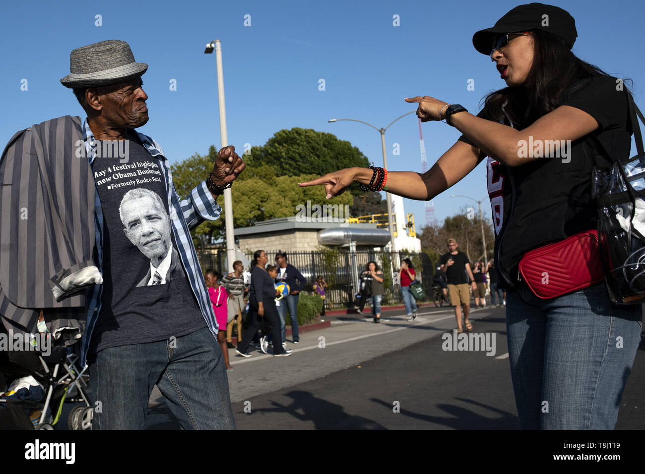 Los Angeles, CA, USA. 4th May, 2019. People seen having fun during the festival.People gather at a festival celebrating the renaming of Rodeo Road to Obama Boulevard, in honor of former US President Barack Obama in Los Angeles, California. Credit: Ronen Tivony/SOPA Images/ZUMA Wire/Alamy Live News Stock Photo