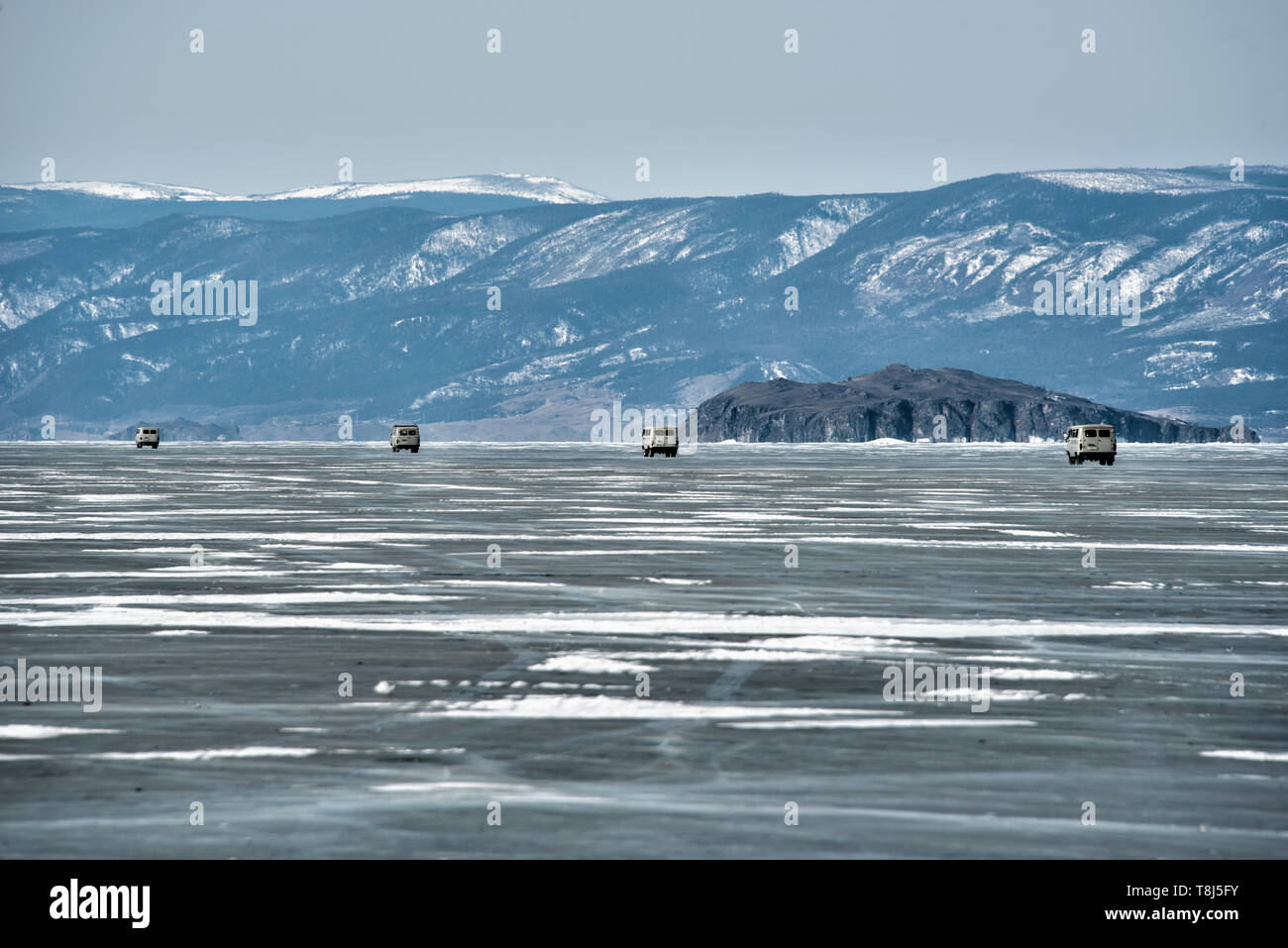 4x4 vehicles driving across Lake Baikal, Siberia, Russia Stock Photo