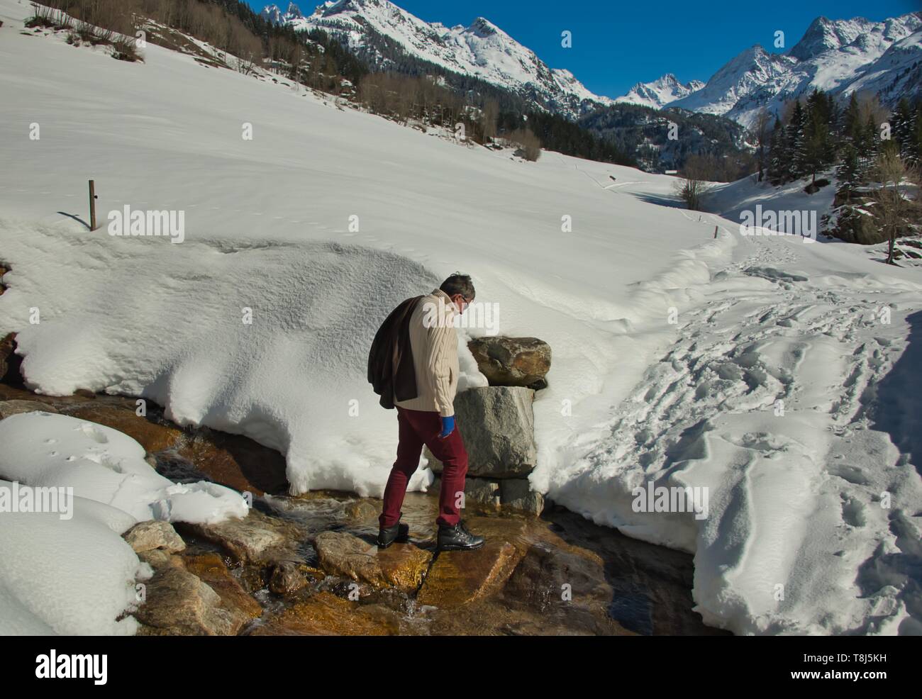 Man hiking in the Alps, Gadmen, Berne, Switzerland Stock Photo