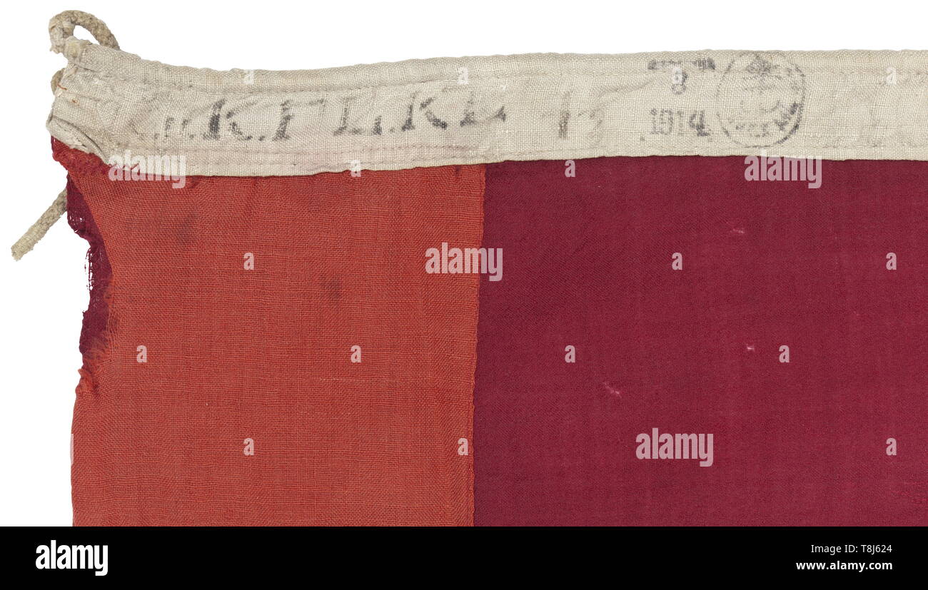 A war flag of the royal-imperial navy in the version as used between 1869 and 1915 Red-white-red printed navy flag, in the centre the crowned shield of gules a fess argent. The leech with hoisting line and stamp 'K.F. ..', date 1914 and inspection stamp. Small holes, slightly stained, the gold colour of the archducal crown and the trim of the shield faded. Measurements circa 190 x 320 cm. Extremely rare flag, the huge size indicates that it must have been in use on a Radetzky or Tegetthoff class battleship. historic, historical, Imperial, Austria, Austrian, Danube Monarchy,, Editorial-Use-Only Stock Photo