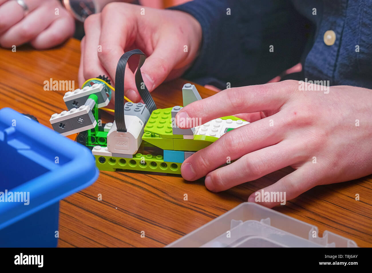 The boy makes a car model from the details of the children's designer Stock Photo