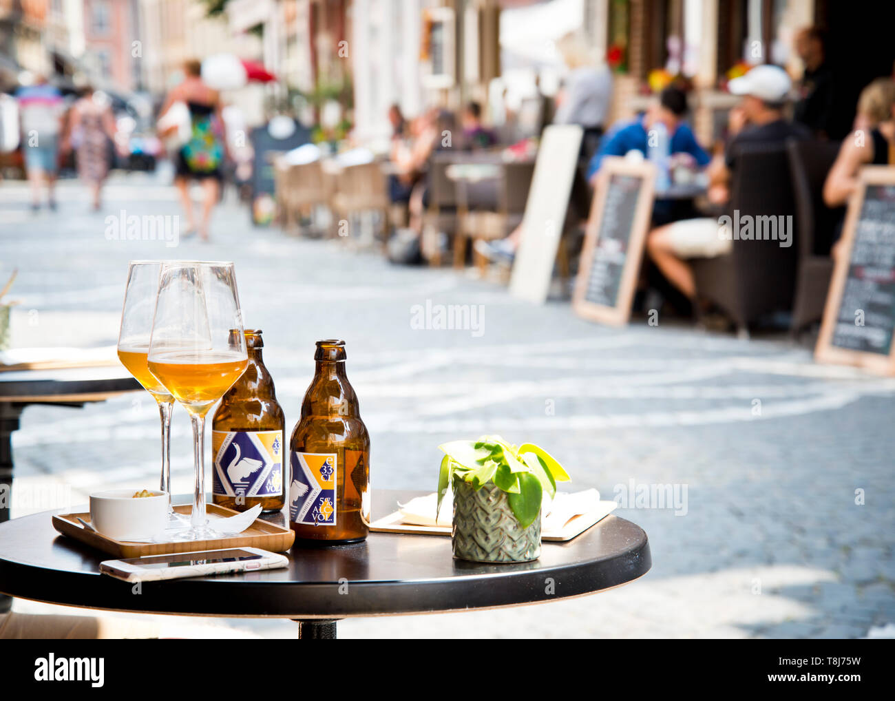 appetizers, alcoholic drinks, beer in glasses on round small table