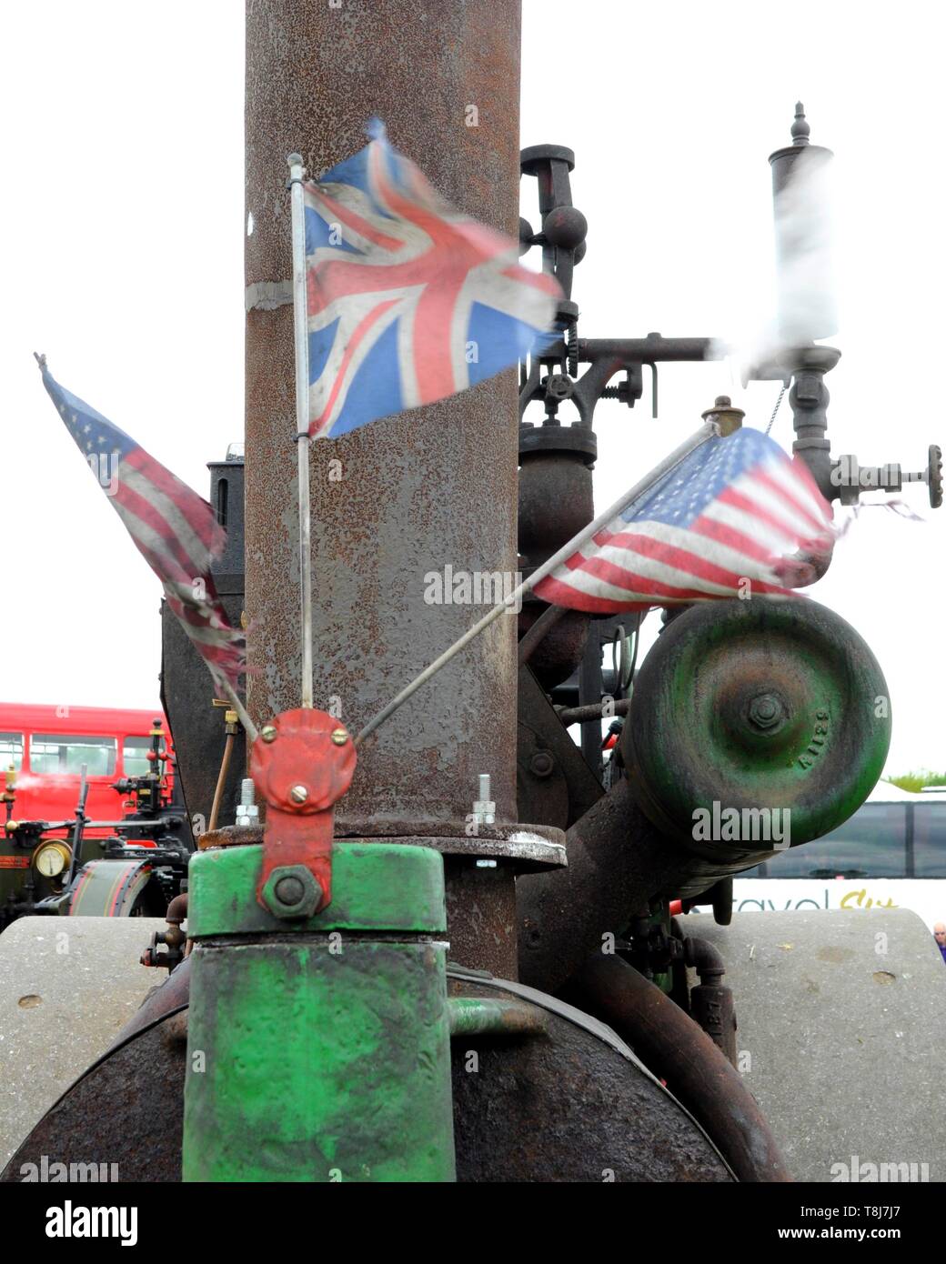 British and American flags on front of 1910 Springfield steamroller at the 2019 Merton Vintage Show near Faversham, Kent, UK. Stock Photo