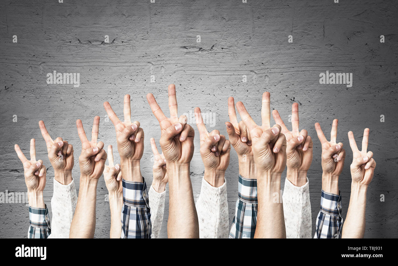 Man hands raised showing two hi-res stock photography and images - Alamy