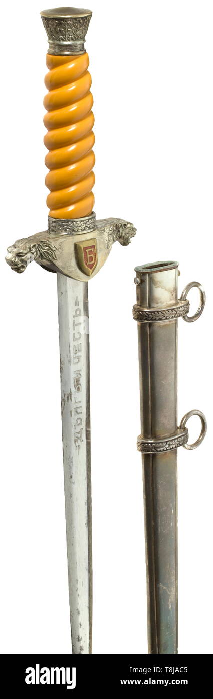 A dagger for leaders in the national youth organization 'Brannik' Nickel plated blade (stained) with Cyrillic inscription (tr.) 'Duty and Honour'. Orange coloured plastic grip, silvered pommel and cross-guard with an applied, enamelled Brannik emblem (a Cyrillic 'B' on a red background). Silvered iron scabbard. Length 36 cm. Of Bulgarian production, stylistically modelled after the German and Bulgarian army daggers. historic, historical, Bulgaria, 20th century, Additional-Rights-Clearance-Info-Not-Available Stock Photo