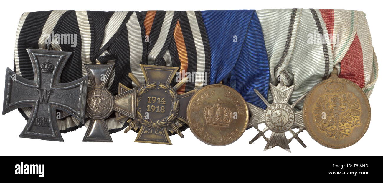 A decorations and documents grouping of later Oberleutnant and winner of the Golden Military Merit Cross (Enlisted Men's Pour le Mérite) Wilhelm Appel A six-piece orders clasp with: Iron Cross 2nd Class of 1914, Military Merit Cross in silver-gilt issue with punch mark accordimg to the regulations 'W 938' in the lower cross arm, German Empire: Honour Cross of the World War 1914/1918 for Combatants 1934, Prussia: Long Service Award 2nd Class for 12 Years 1913, Bul 20th century, Additional-Rights-Clearance-Info-Not-Available Stock Photo