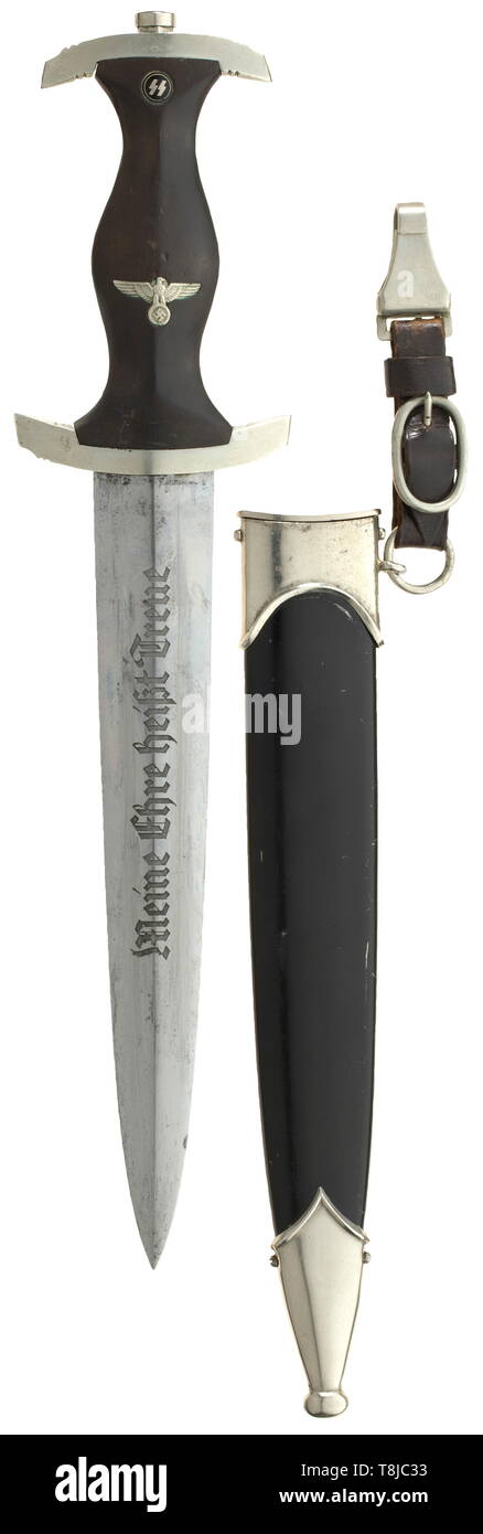 An SS service dagger M 33 by Robert Klaas, Solingen The blade with etched maker logo and motto. Nickel silver grip fittings, the cross guard punched 'I'. Black wooden grip with inset nickel silver eagle and enamelled SS emblem. Black lacquered steel scabbard (unusual for an early dagger) with nickel silver scabbard fittings. Short black leather hanger. All parts original. Length 38 cm. historic, historical, 20th century, 1930s, 1940s, Waffen-SS, armed division of the SS, armed service, armed services, NS, National Socialism, Nazism, Third Reich, German Reich, Germany, milit, Editorial-Use-Only Stock Photo