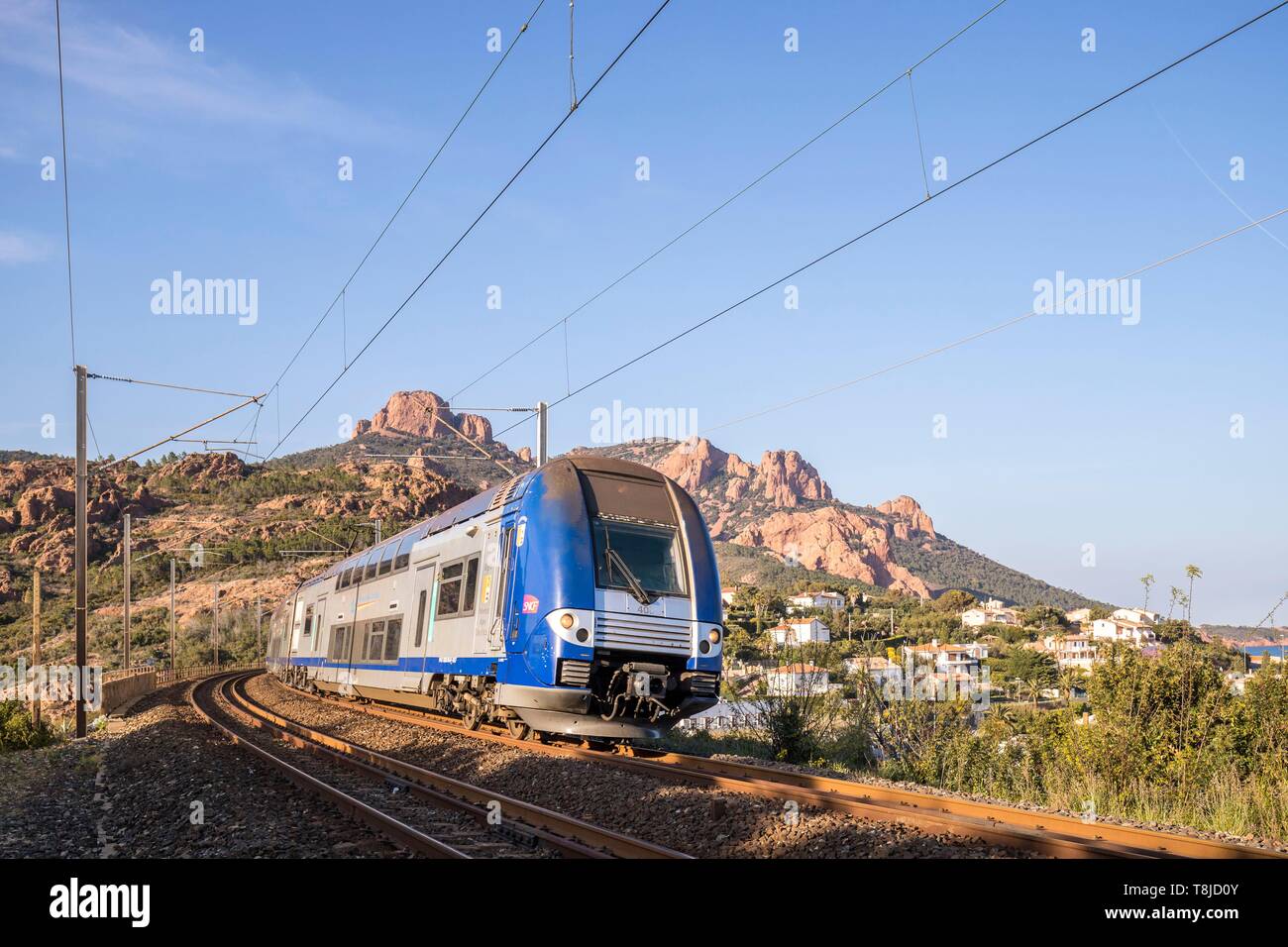 France, Var, Saint Raphael, Esterel Corniche, regional train TER on the viaduct of the cove of Antheor, in the background the Esterel massif and the peaks of the Cap Roux Stock Photo