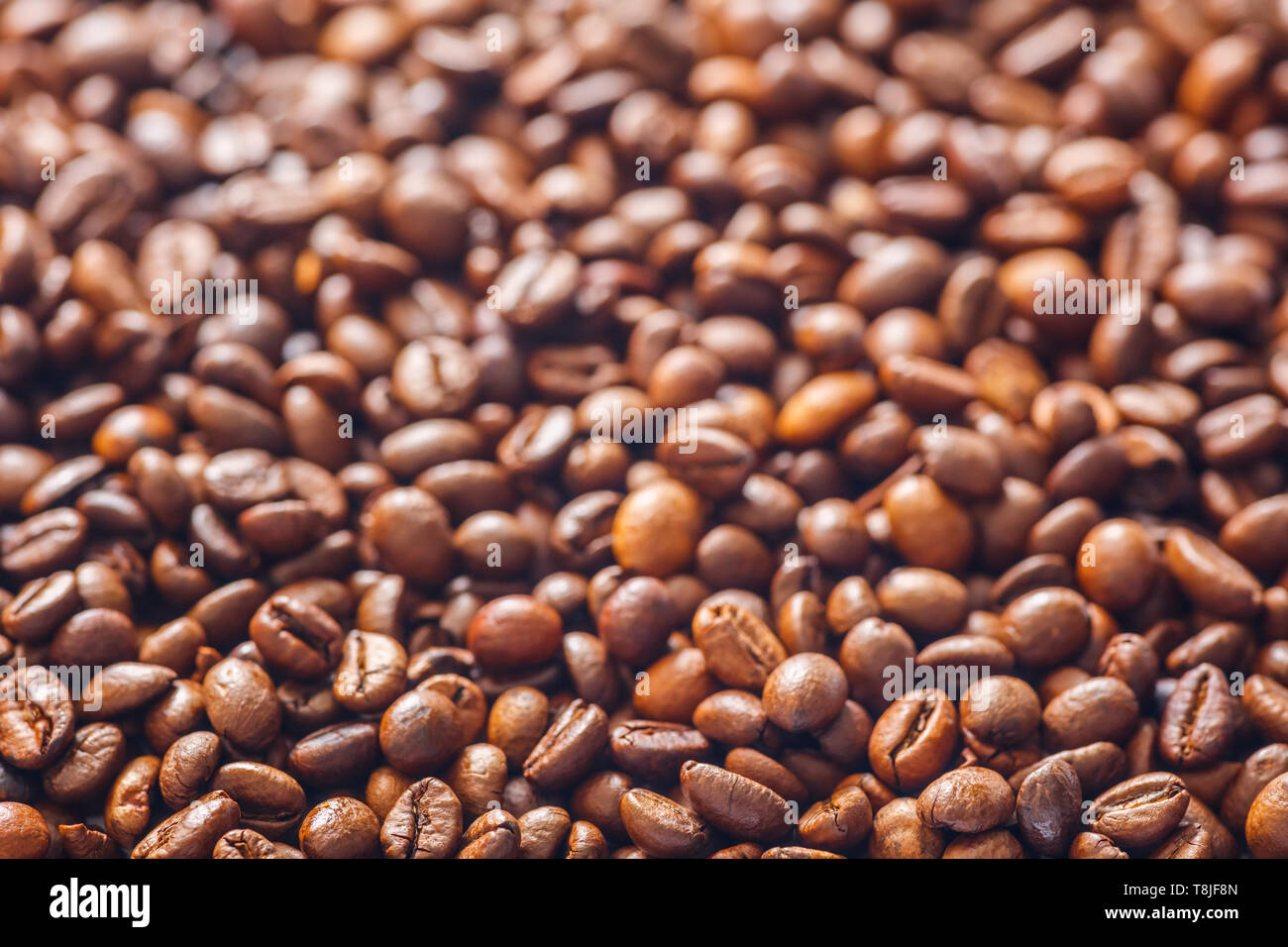 Roasted coffee beans texture background Stock Photo - Alamy