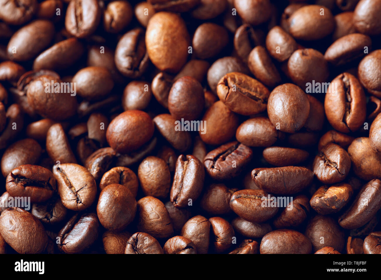 Roasted coffee beans texture background Stock Photo - Alamy