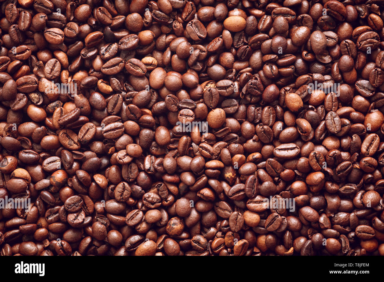 Roasted coffee beans texture background Stock Photo - Alamy