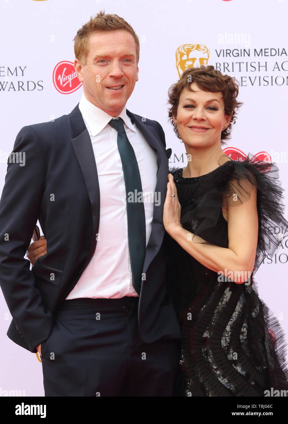 Damien Lewis and Helen McCrory are  seen on the red carpet during the Virgin Media BAFTA Television Awards 2019 at The Royal Festival Hall in London. Stock Photo