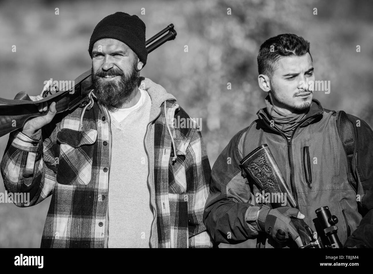 Hunters poachers looking for victim. Hunters with rifles in nature