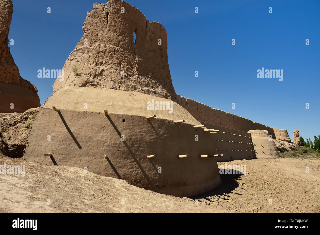 The ruins castles of ancient Khorezm – Guldursun - Kala, restored mud curtain walls, Uzbekistan. Stock Photo