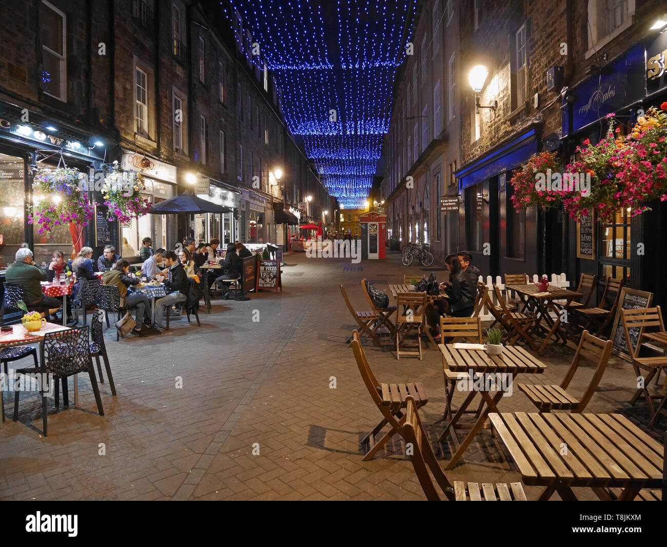 EDINBURGH - SEPTEMBER 2016:  Rose Street is a popular area for restaurants and pubs open late in the evening, as seen in Edinburgh circa 2016. Stock Photo