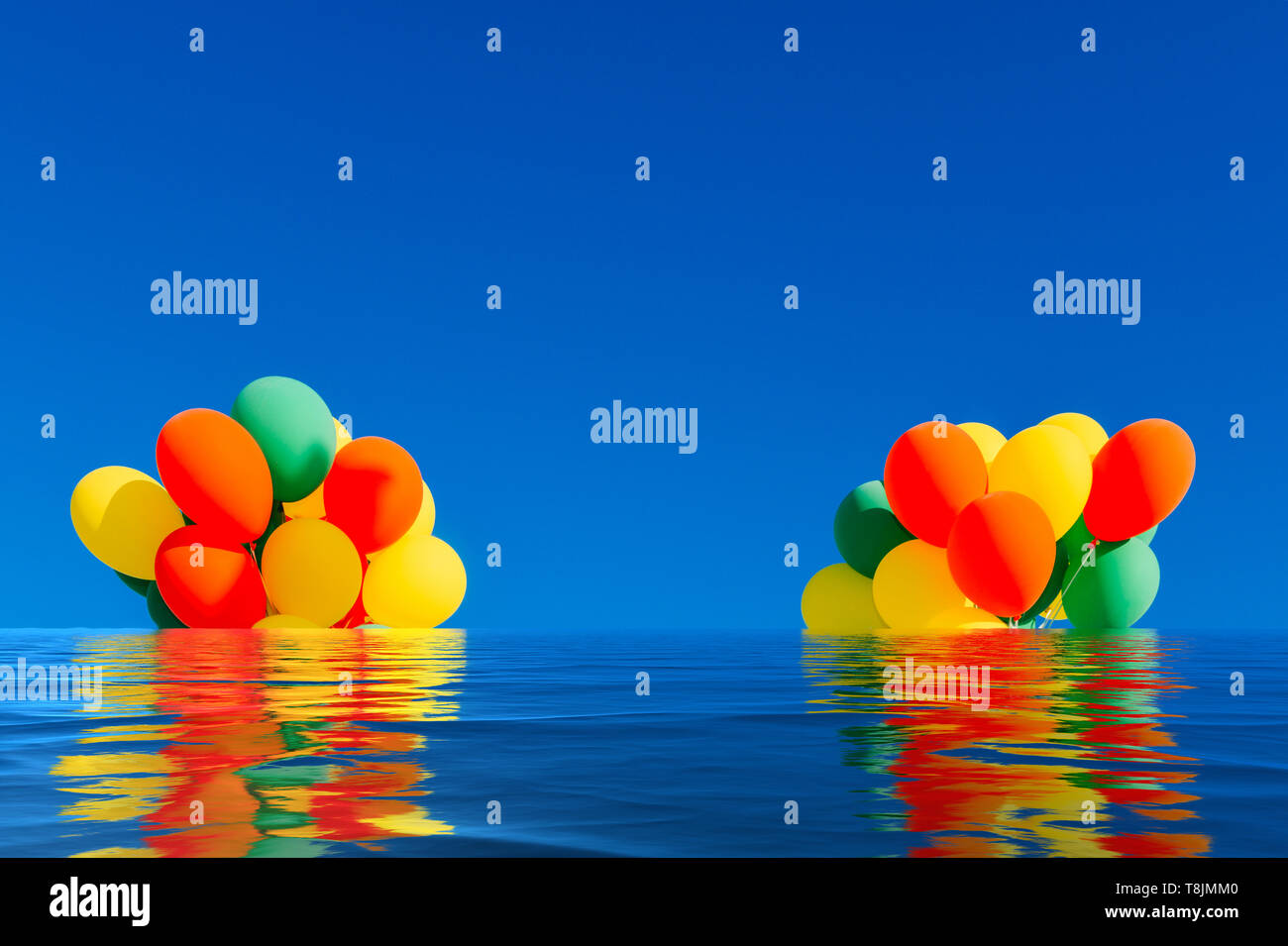 Flooded colorful balloons on a blue sky background with reflection on water. Stock Photo