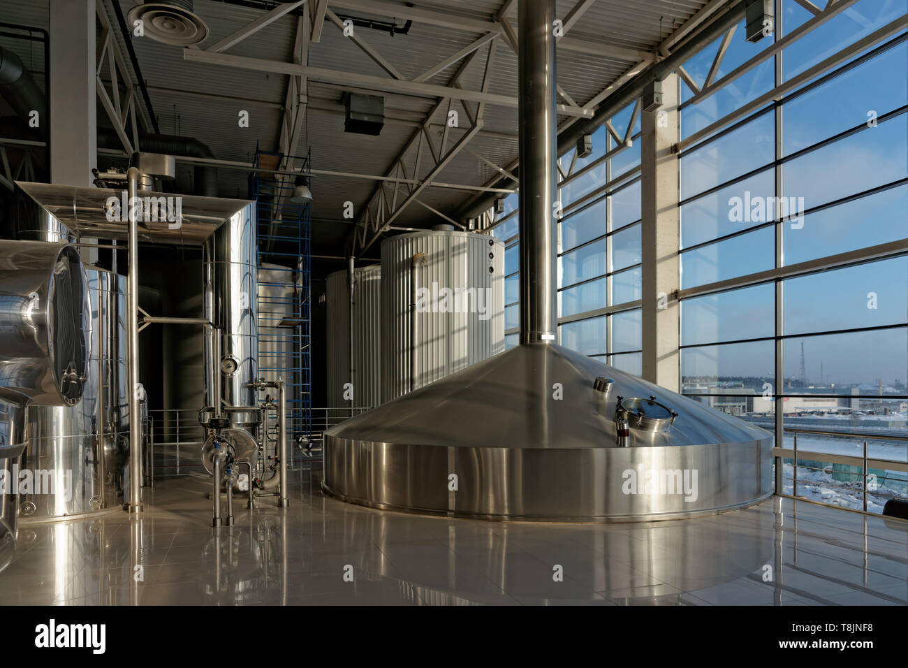 Beerbrewing tanks in an industrial building Stock Photo Alamy