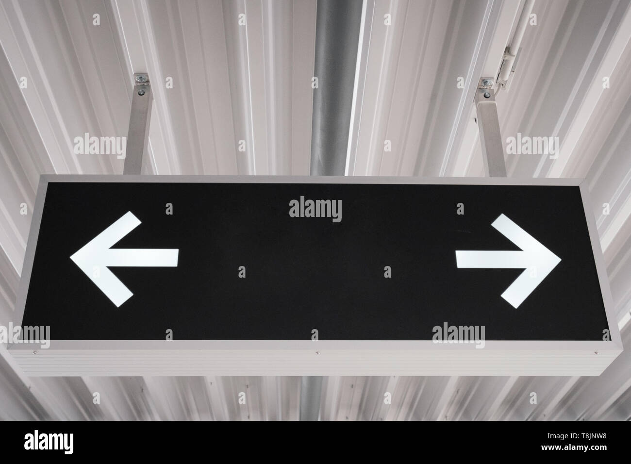 empty sign mockup on ceiling / blank sign mock-up with arrows Stock ...
