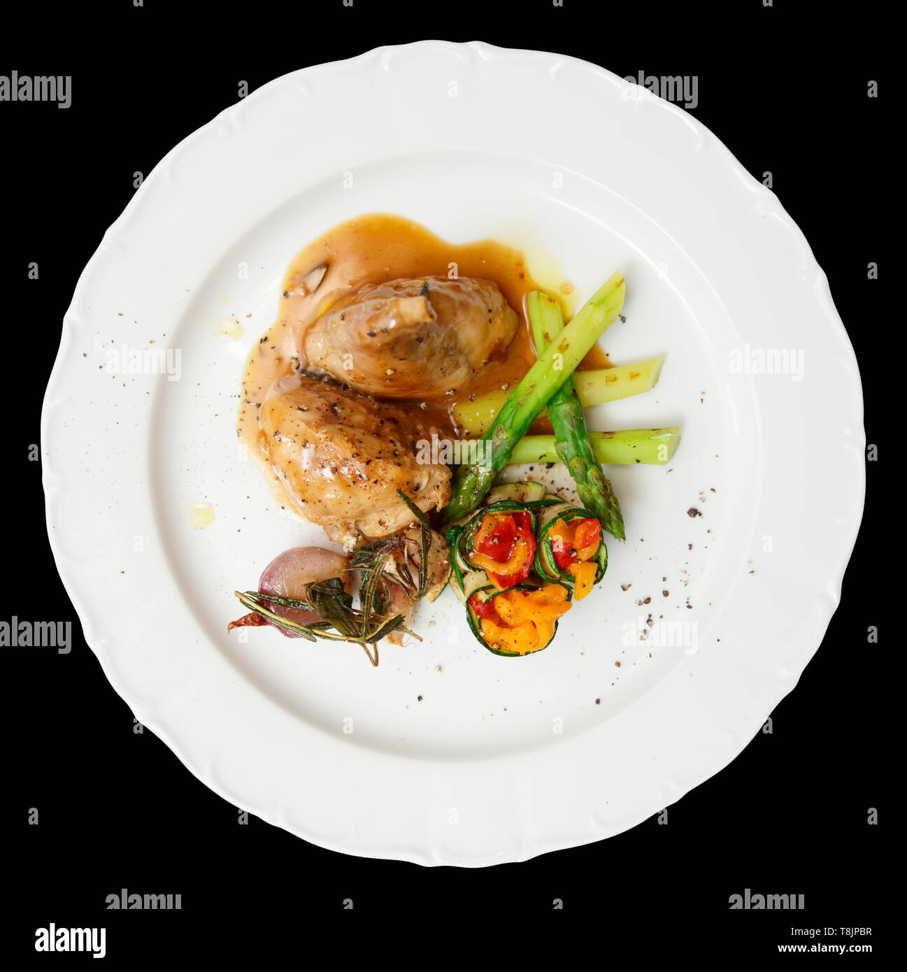 Rabbit stew with vegetables isolated on black Stock Photo