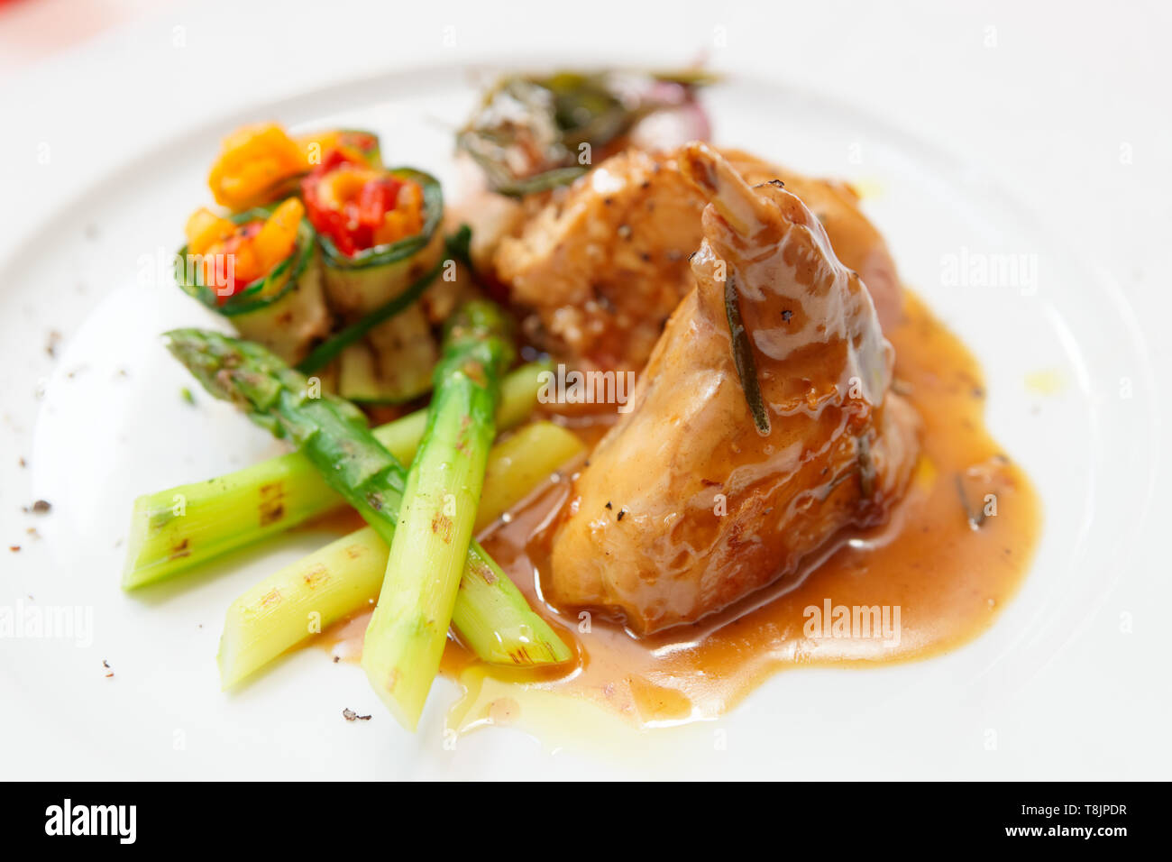 Rabbit stew with vegetables on plate Stock Photo