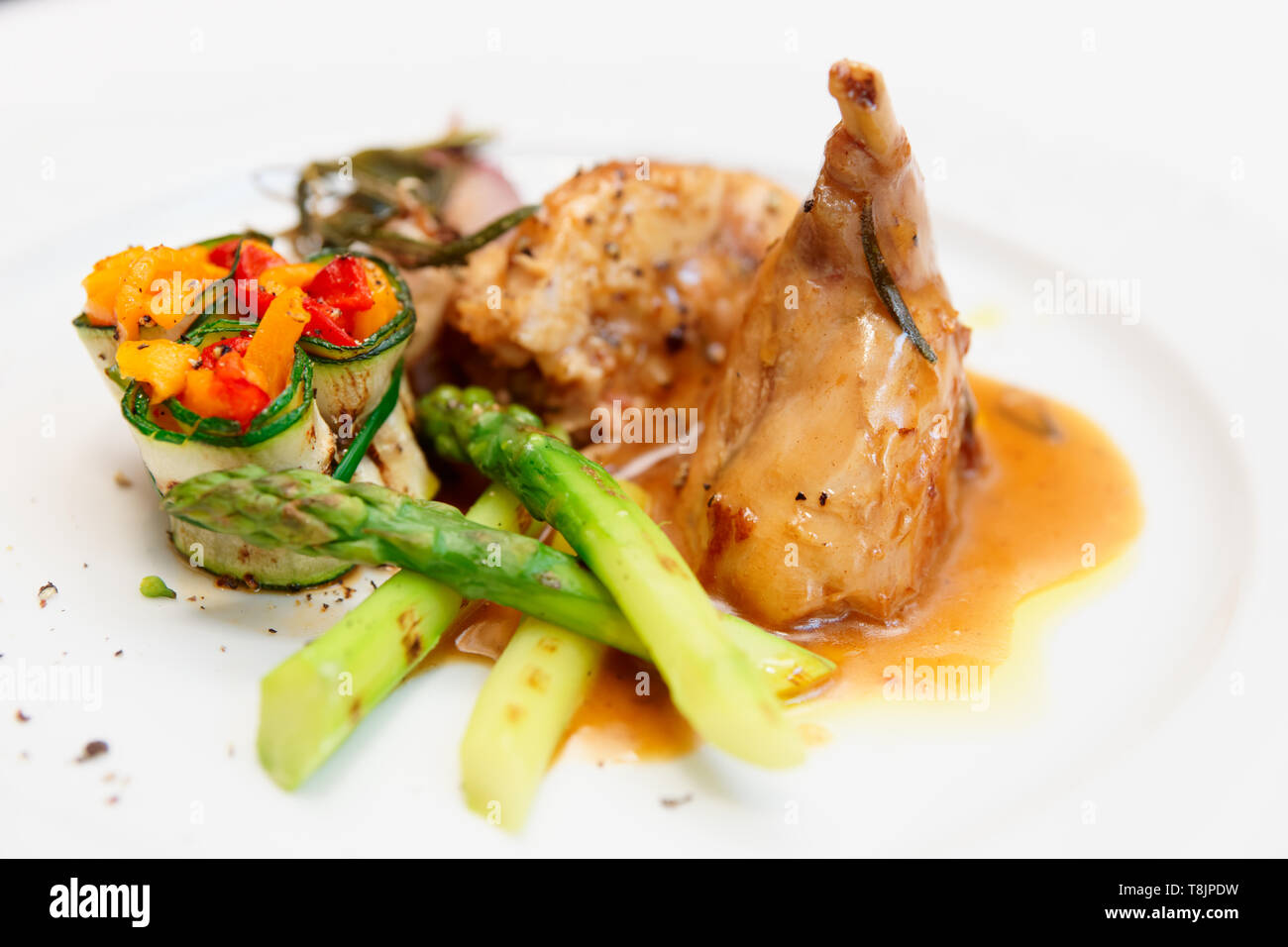 Rabbit stew with vegetables on plate Stock Photo