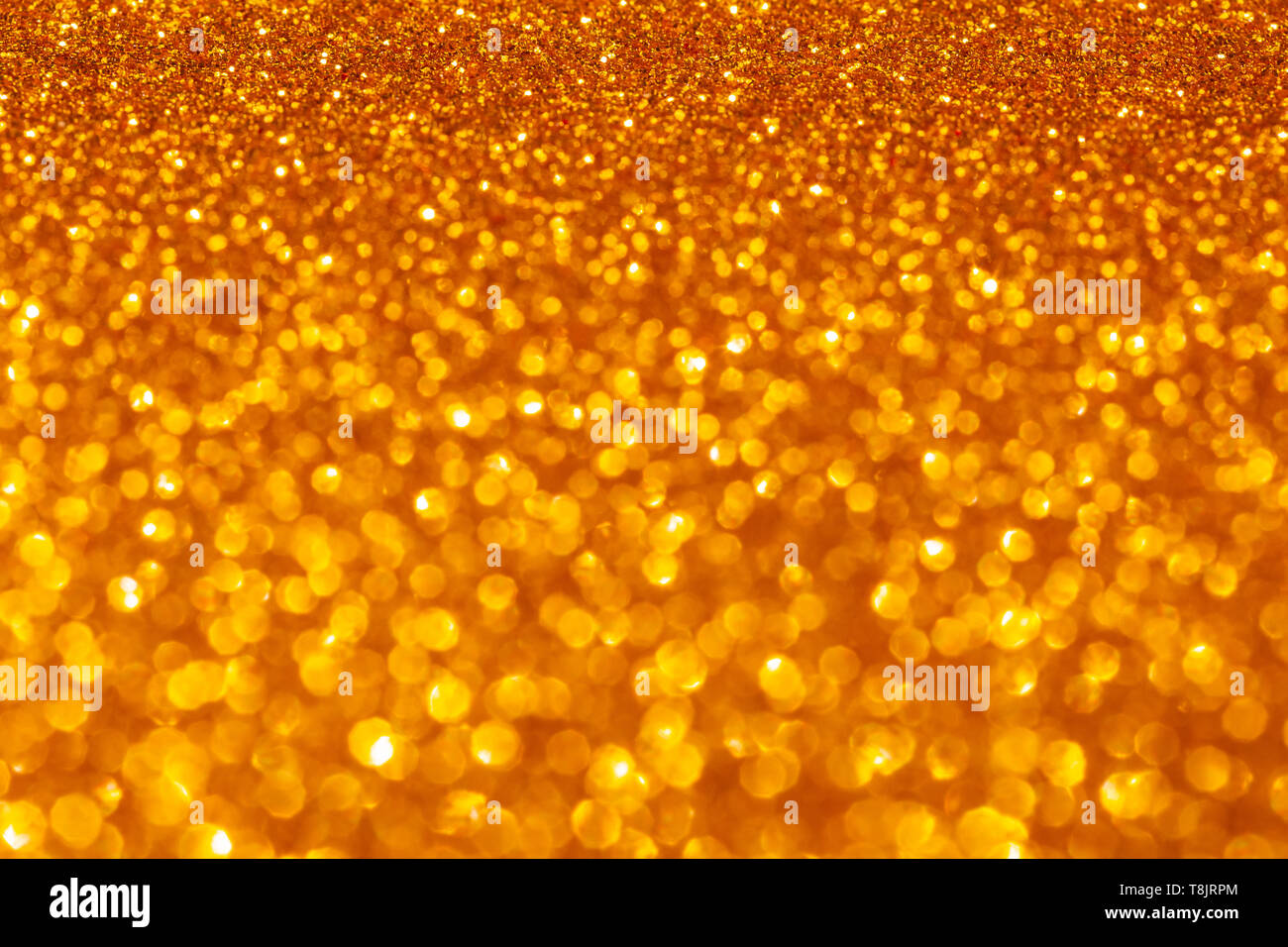 Gold glitter vintage lights background. defocused. Texture Pattern Background. Concept Festive overlay Stock Photo