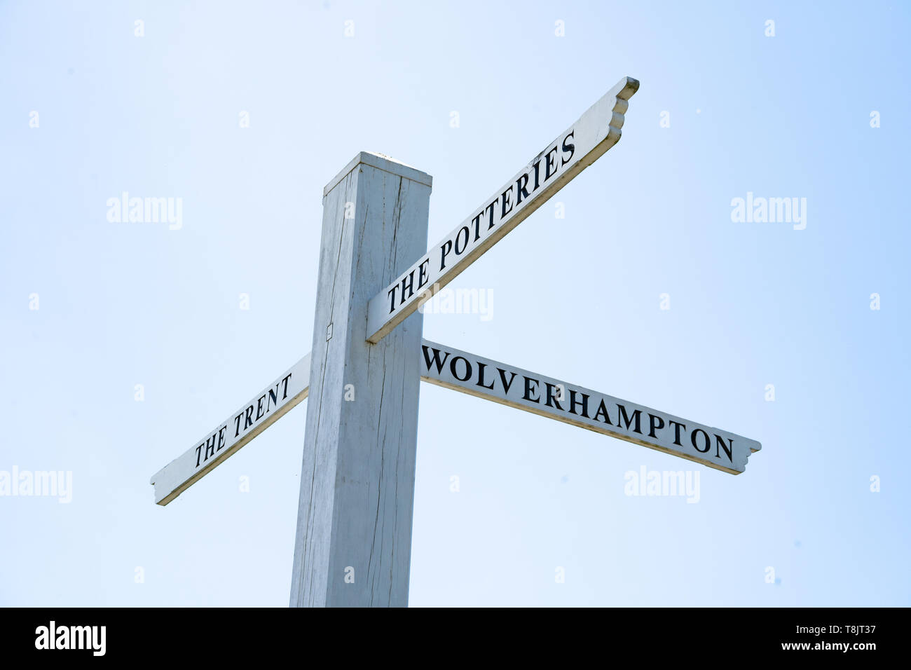 Wooden signpost for The Potteries, The Trent, Wolverhampton on the junction of the Trent and Mersey canal and the Staffordshire and Worcester canal Stock Photo