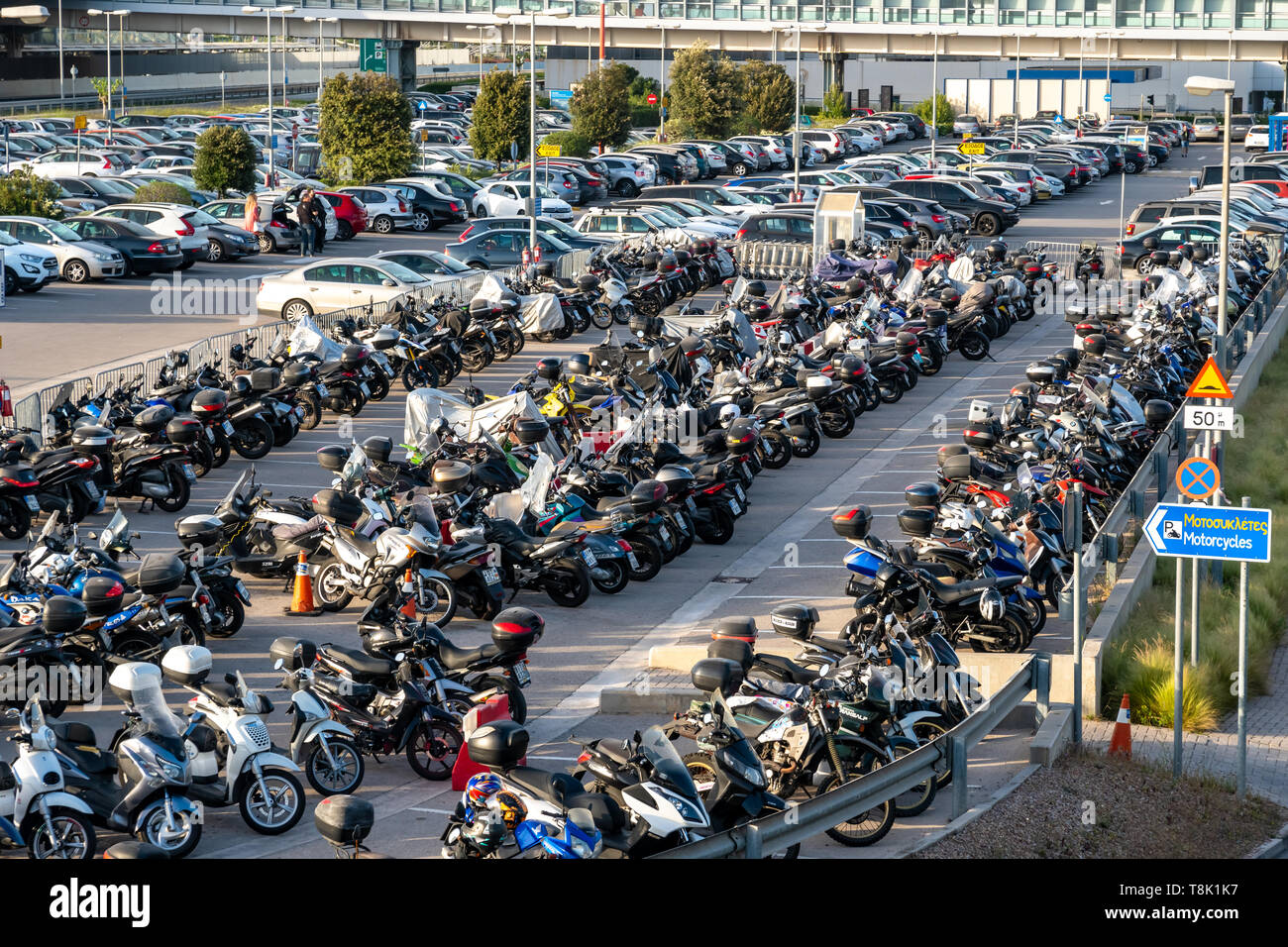 Athens, Greece - 27.04.2019: a lot of motorcycles and cars at the Athens  airport, parking Stock Photo - Alamy