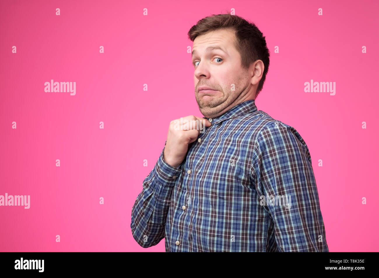 young man in blue shirt with a double chin. Stock Photo