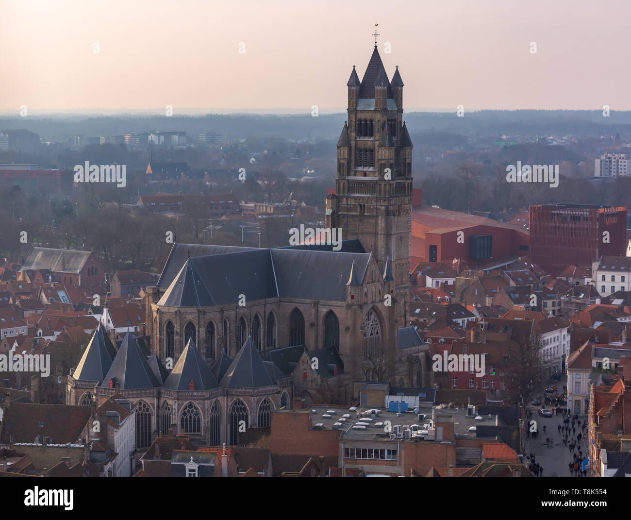 Fantastic Bruges city skyline with red tiled roofs and Saint-Salvator Cathedral tower in winter day. View to Bruges medieval cityscape from the top of Stock Photo