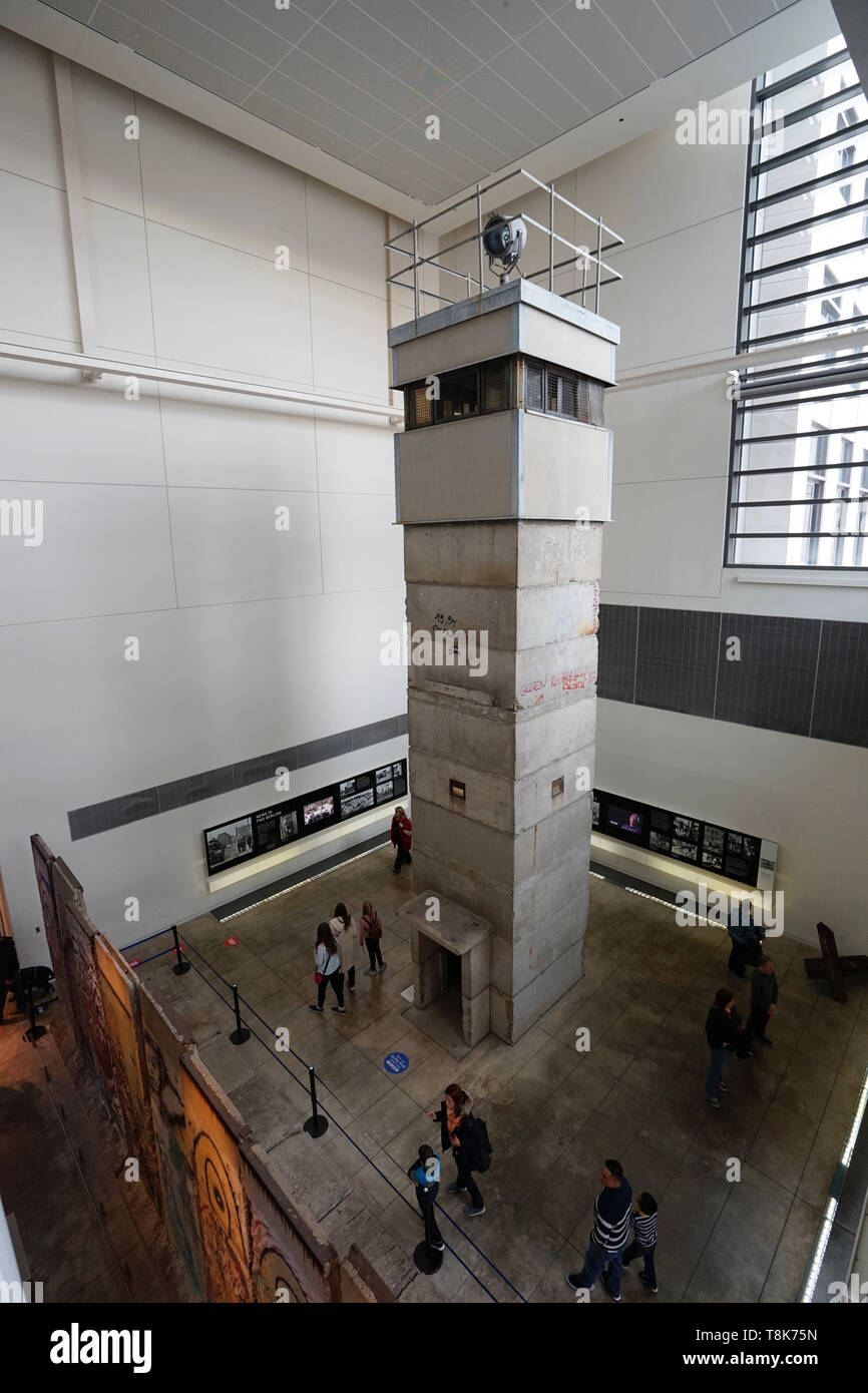Watchtower of Berlin Wall with a section of Berlin Wall display in