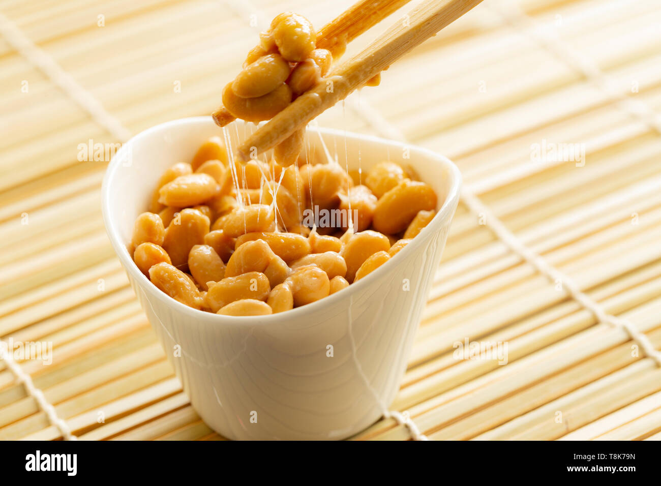 Eating healthy traditional japanese fermented soybeans called natto