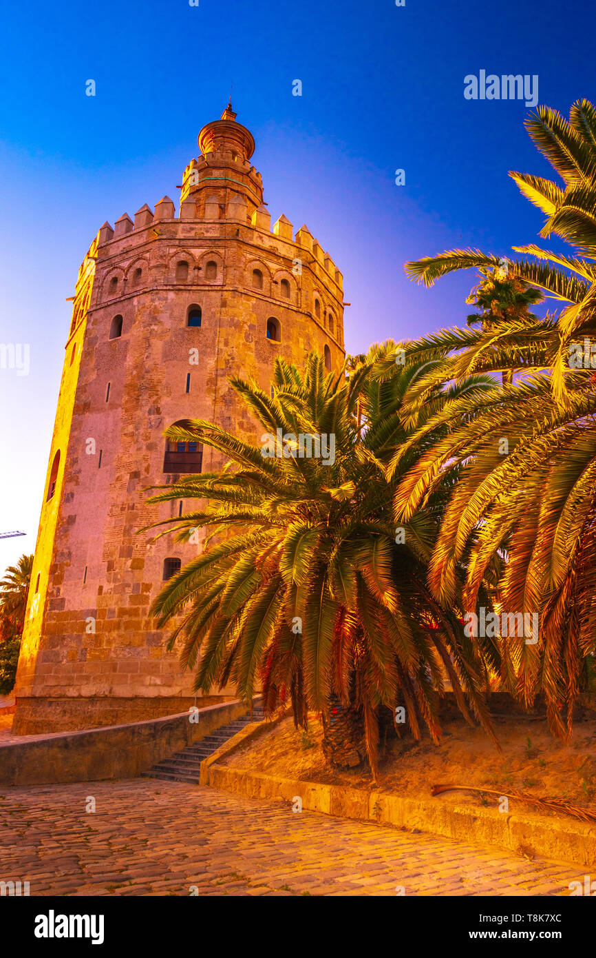 Torre del Oro, meaning Golden Tower, in Seville, Spain is an Albarrana Tower located on the left bank of the Guadalquivir River Stock Photo