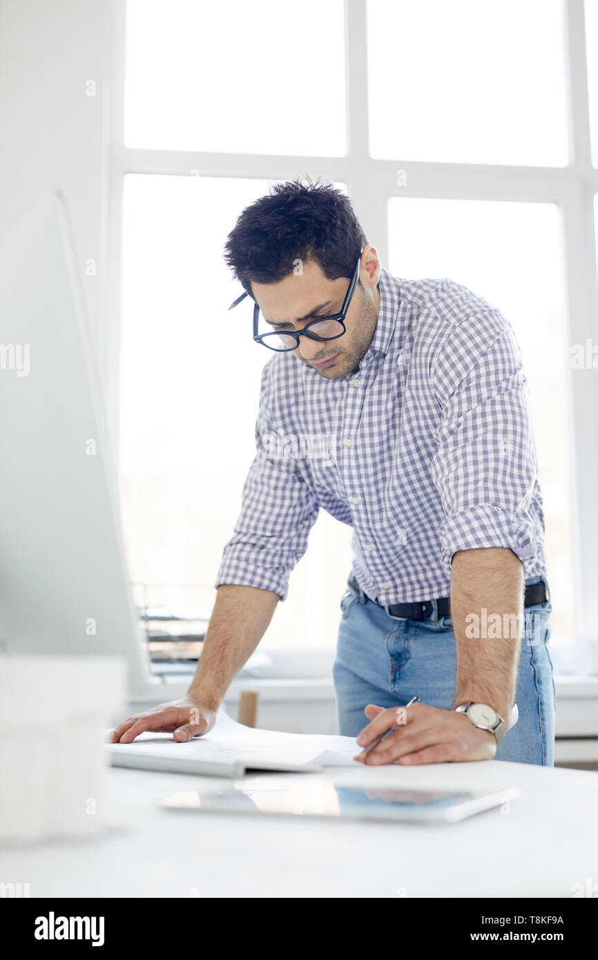 Middle-Eastern Man Working in Office Stock Photo