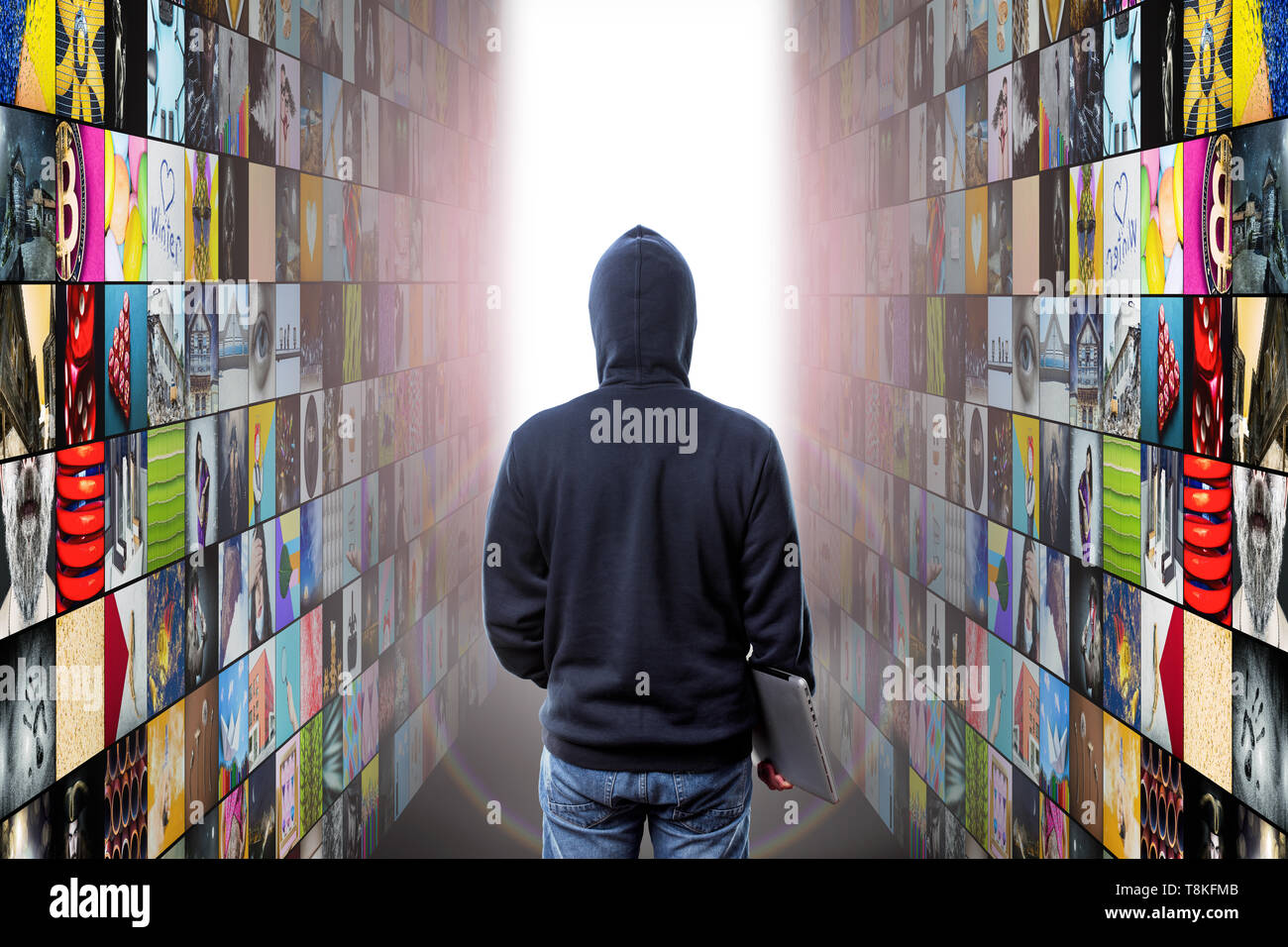 hacker with laptop enters at abstract multimedia background made from ...