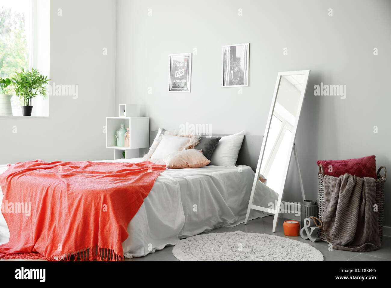 Interior Of Beautiful Bedroom With Big Mirror Stock Photo