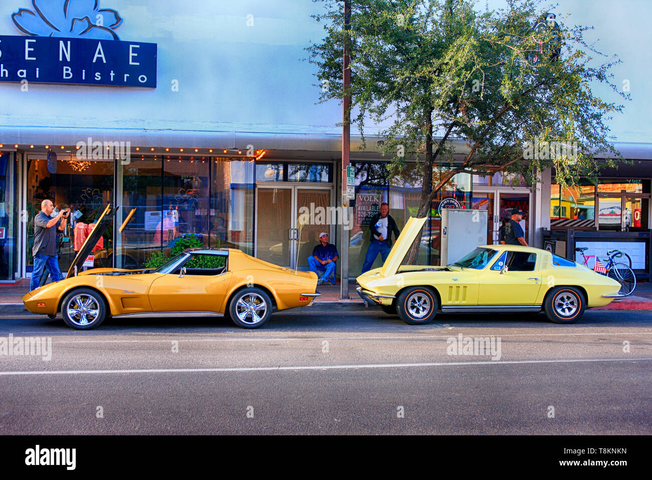 1970 Chevy C3 Corvette Stingray with a late 1960s Chevy C2 Corvette behind it on E Congress St in downtown Tucson AZ Stock Photo