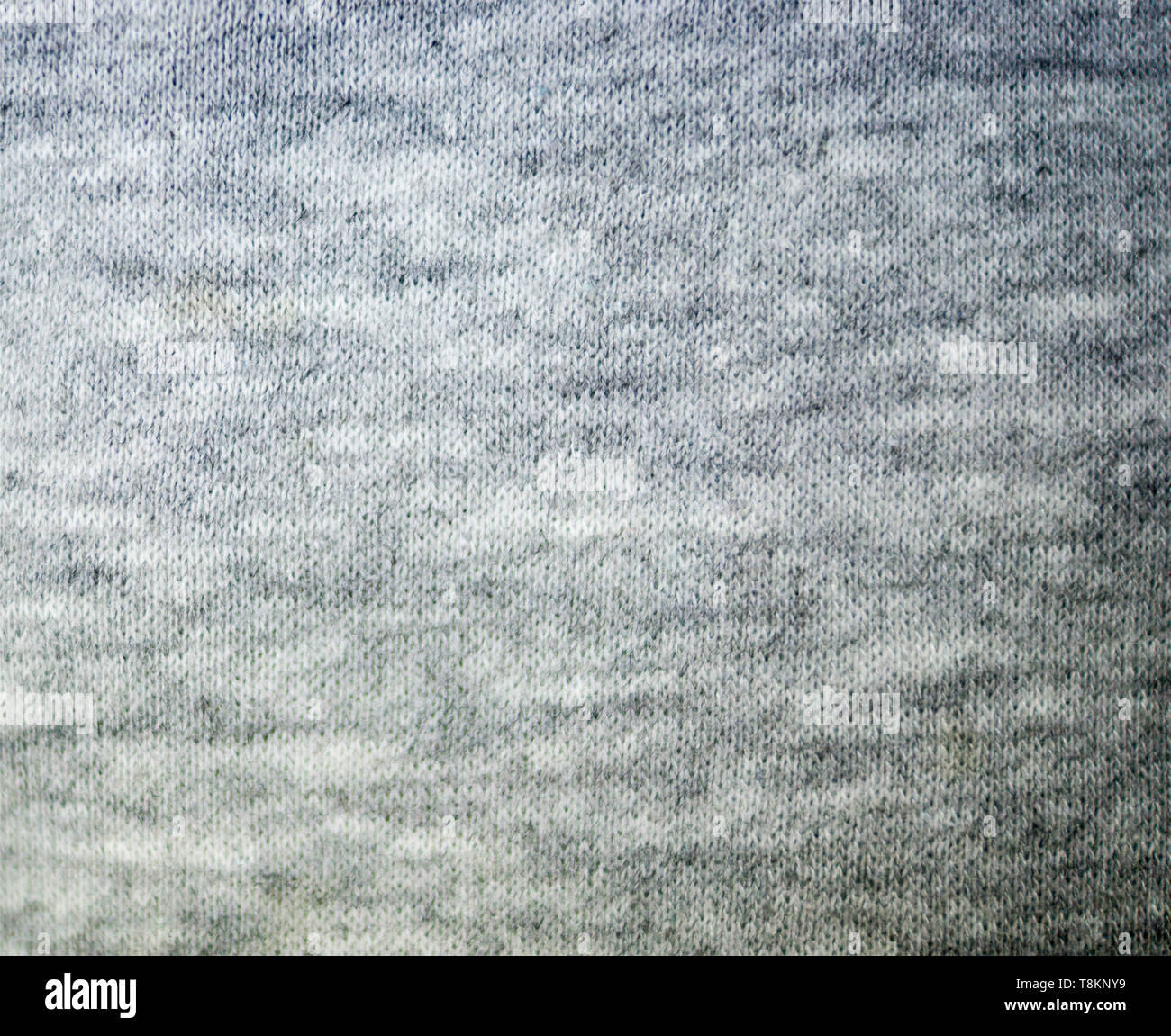 gray knitted fabric textile texture. background, close-up Stock Photo