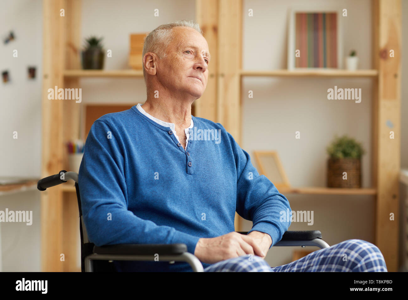 Old man wheelchair thinking hi-res stock photography and images - Alamy