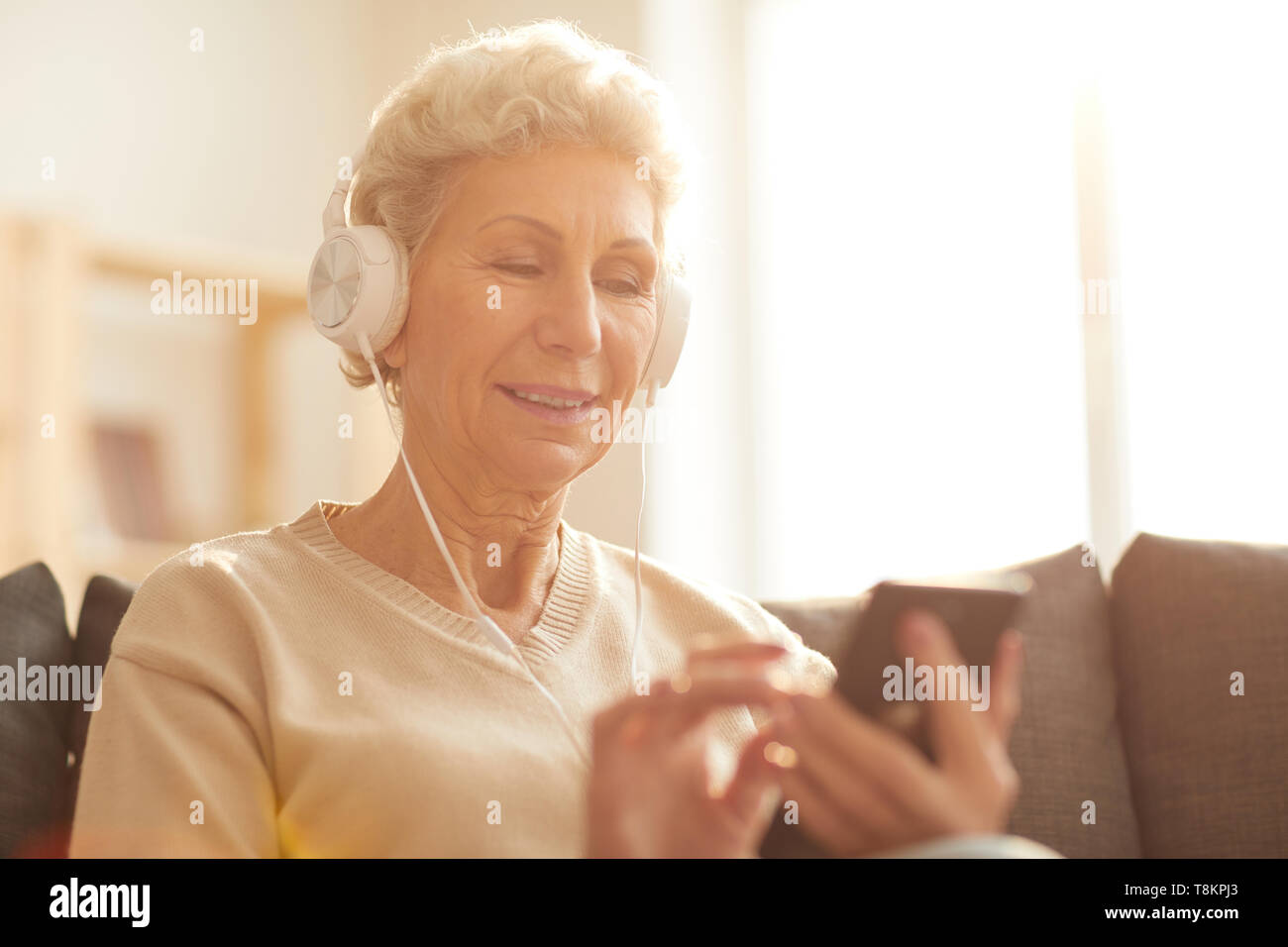 Senior Woman Using Technology Stock Photo